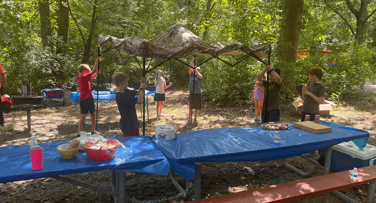 Neighbors gathered at picnic tables in Brentwood Park