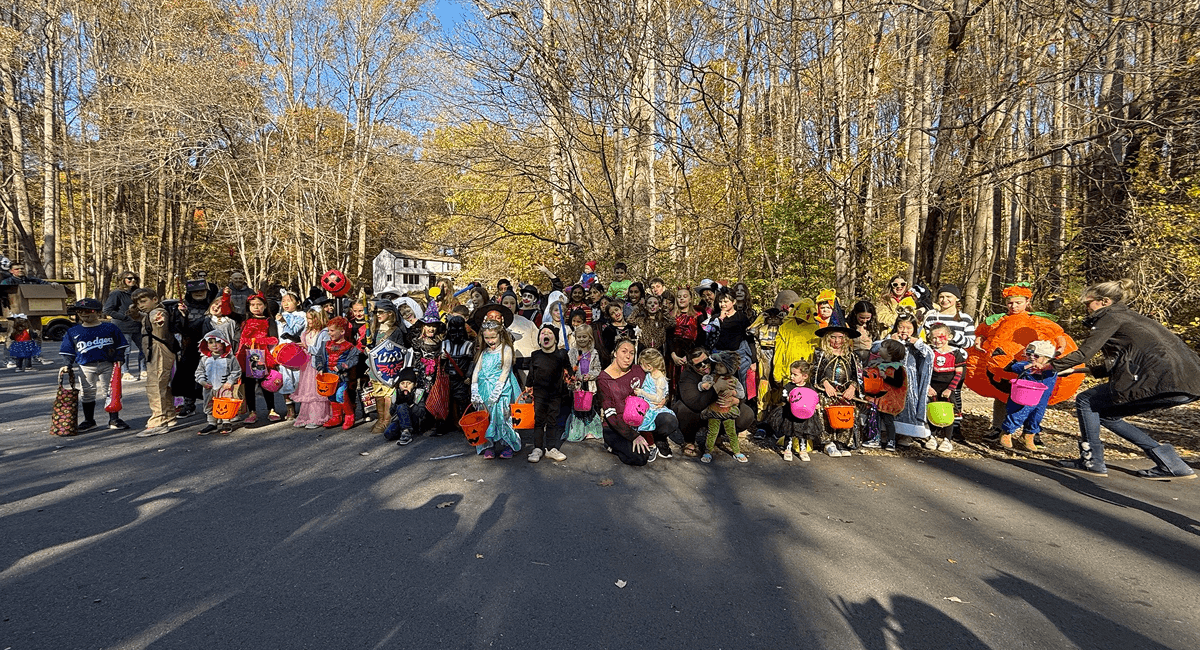 Neighbors walking in the annual Pumpkin Parade